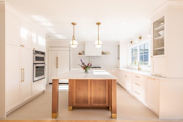 Kitchen With White Countertops & Cabinets